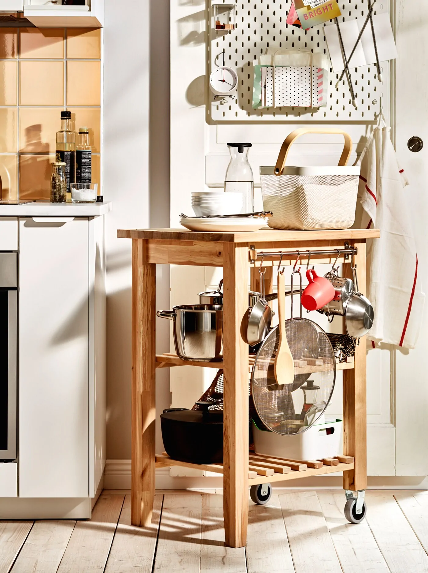 a-wooden-bekvaem-trolley-with-pots-pans-and-other-kitchen-ac-699adfb9d38b195a66fa62724fef81f5